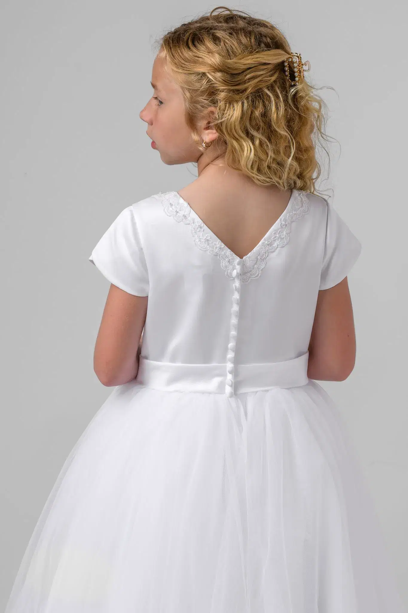 Girl in tiered white gown