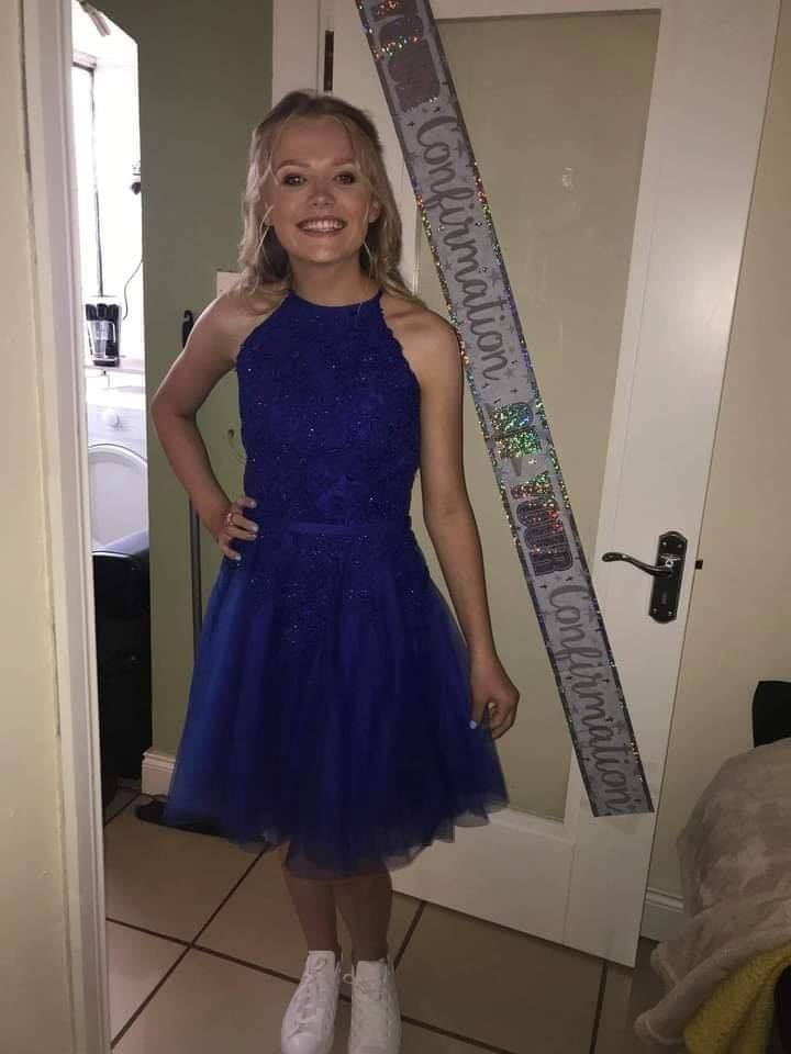 teenage wearing blue dress