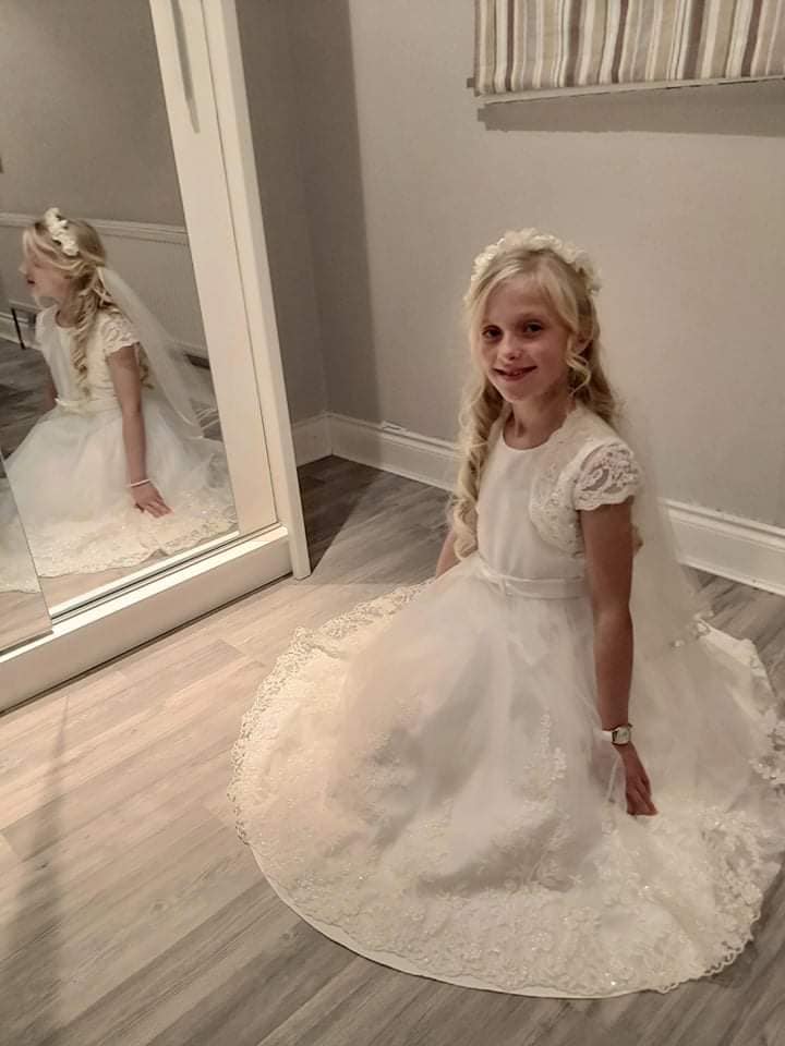 girl wearing white dress in a mirror