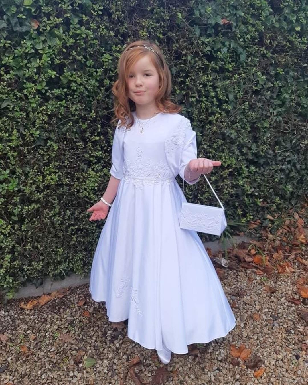 girl in white dress with her bag