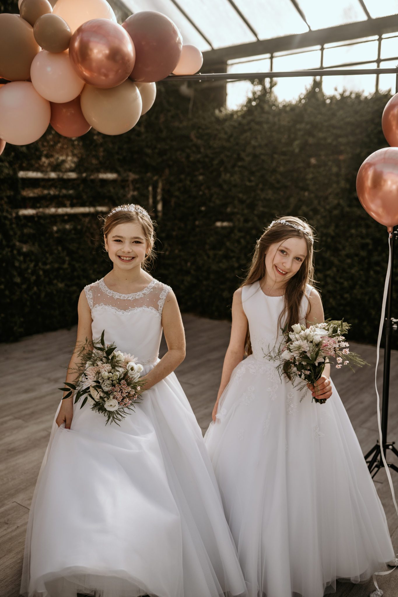 Two little girls in white dress