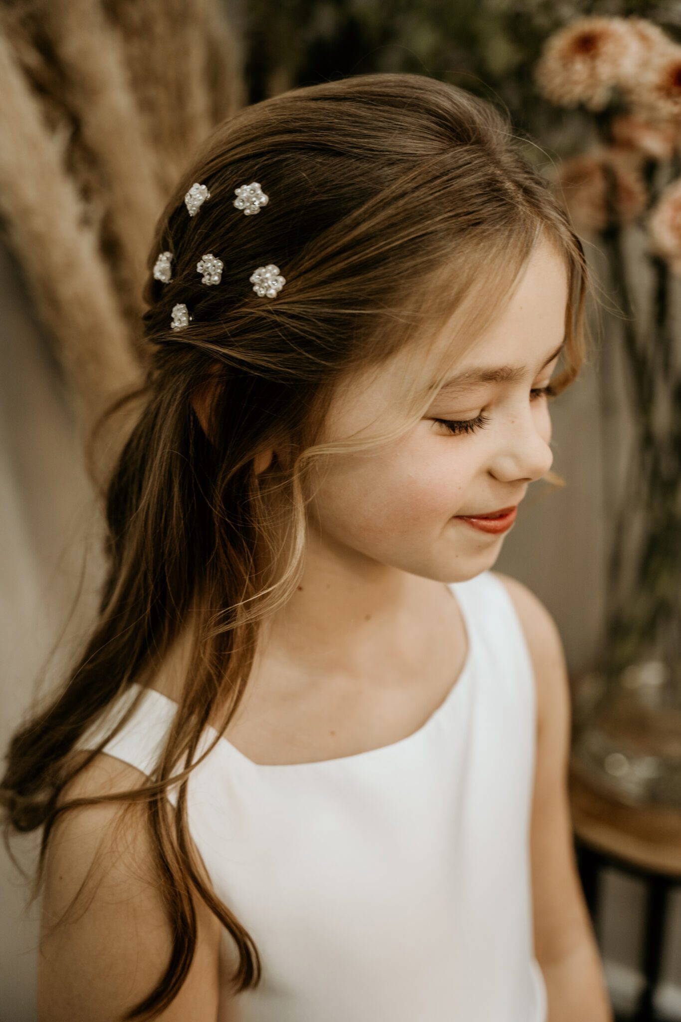 child with a flower in the hair