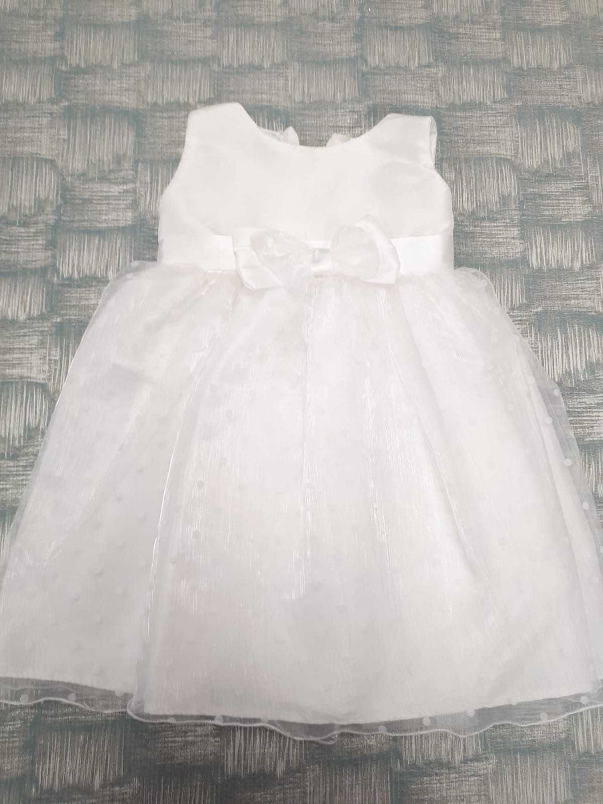 White sleeveless dress with bow