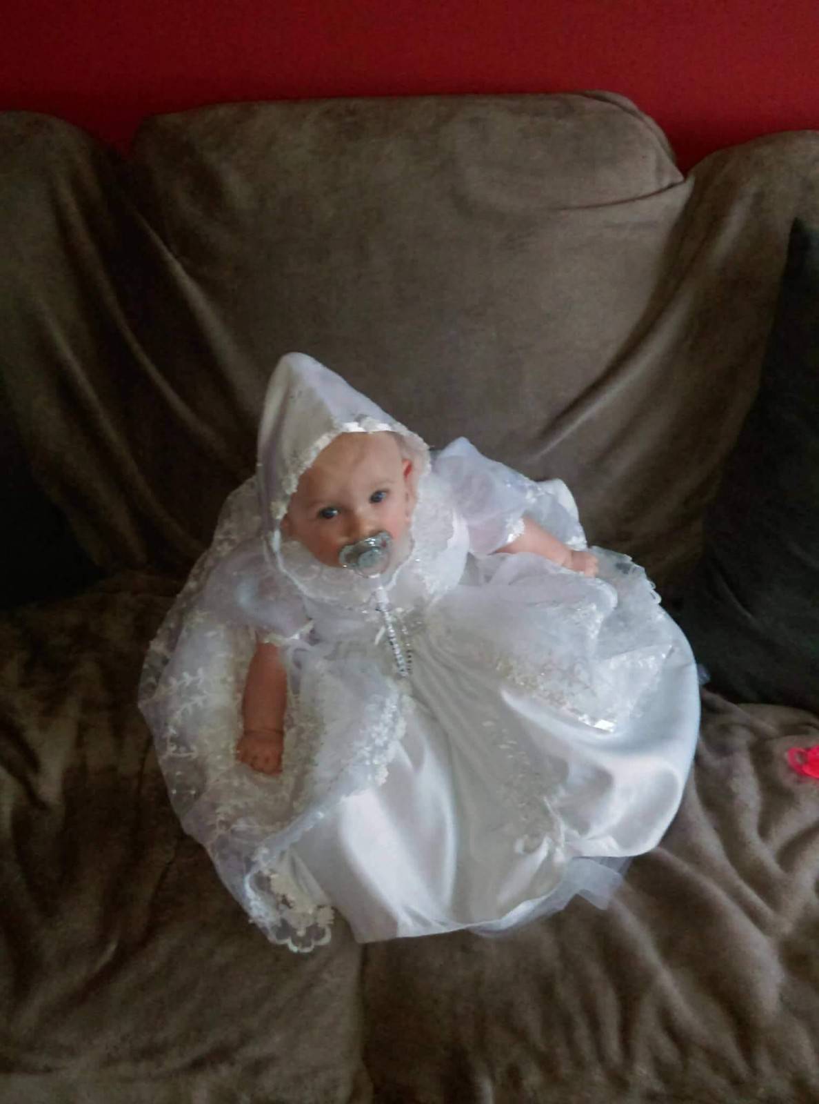 Baby in christening gown
