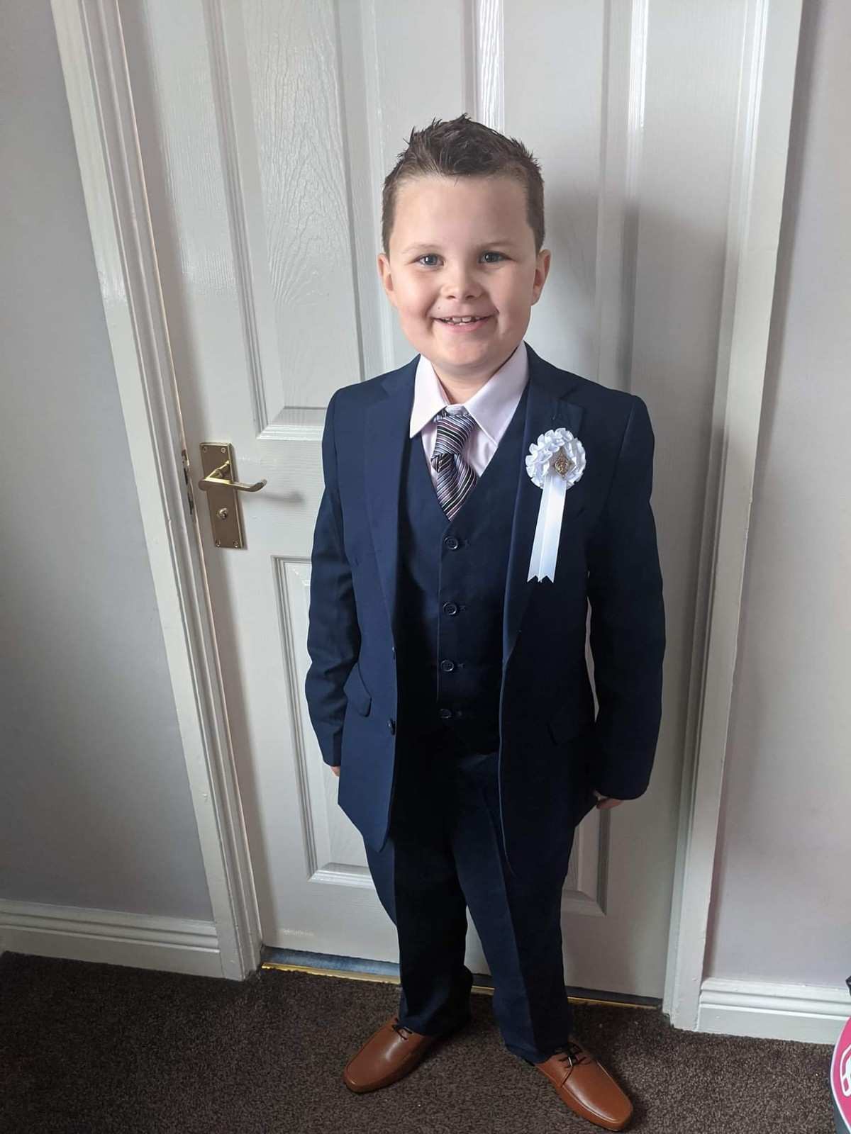 Boy in navy suit