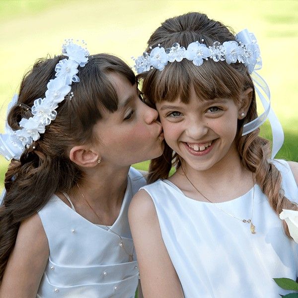 Two girls with floral wreaths